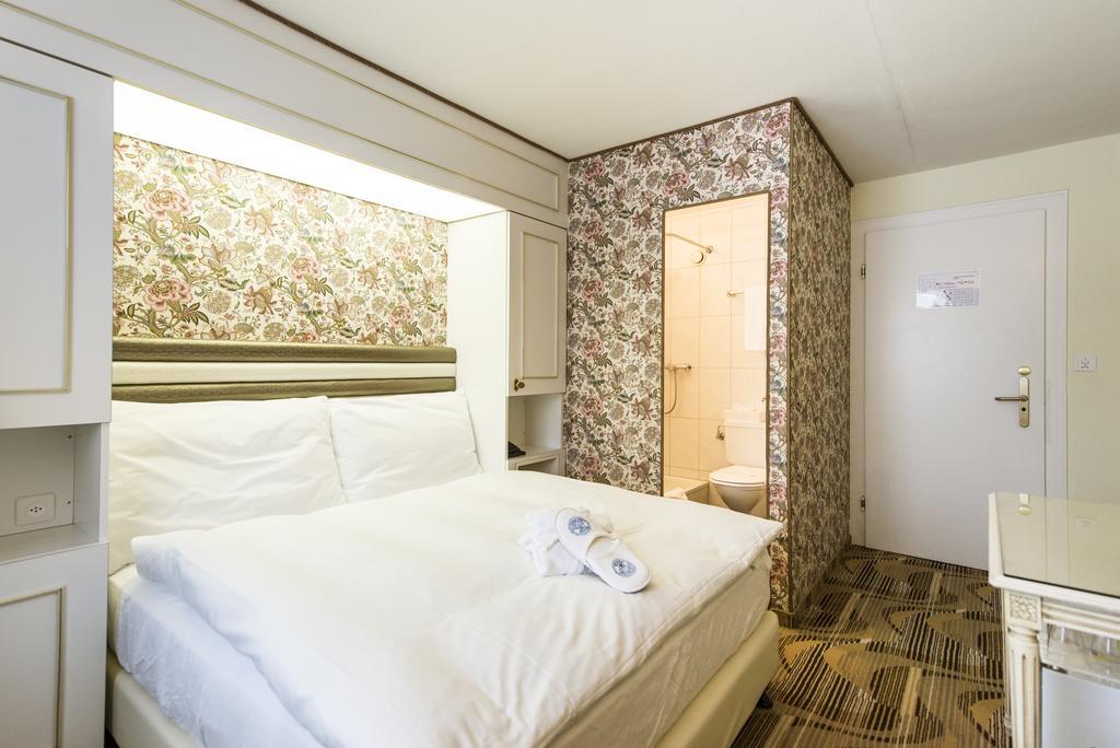 Posthotel Holiday Villa Arosa Quarto foto